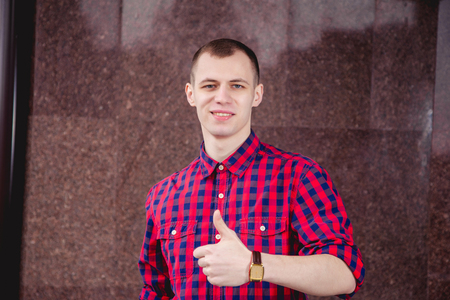 Male model posing for the camera, men's clothingの写真素材