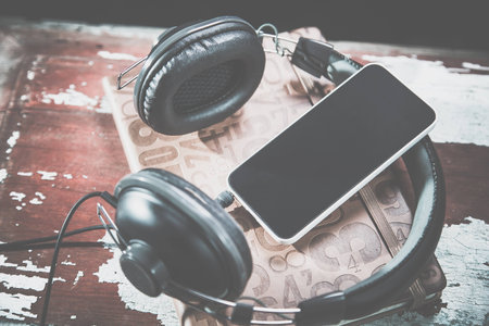 Headphones and phone vintage photos, listen to musicの写真素材