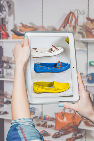 girl photographed shoes online saleの写真素材