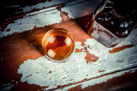Two glasses of whiskey vintage photo, a bottle on the bar vintageの写真素材