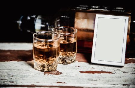 Two glasses of whiskey standing on the bar Vintage photoの写真素材