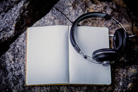 Playlist, headphones and notebook natureの写真素材