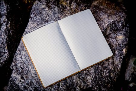 Entries in a notebook, net notebook on a granite stone aの写真素材