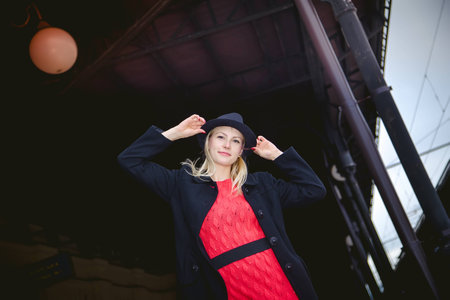 The girl in the hat at the railway stationの写真素材