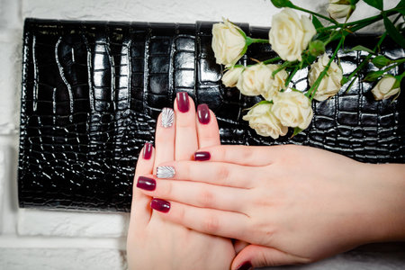 women's manicure on leather reticuleの写真素材