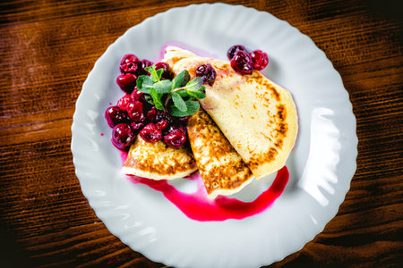Delicious pancakes with fresh cherries, breakfastの写真素材