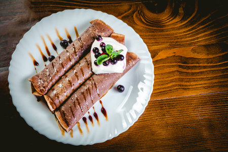 Tiramisu Pancakes with cream and berries, sweet, watering chocolateの写真素材