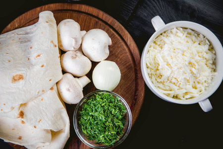 mushrooms, pita bread, herbs, spices, ingredients for the rollsの写真素材