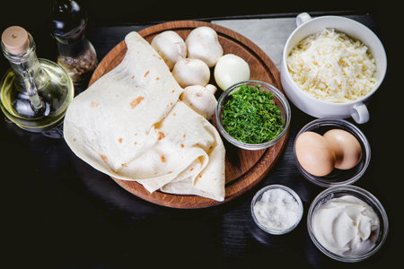 mushrooms, pita bread, herbs, spices, ingredients for the rollsの写真素材