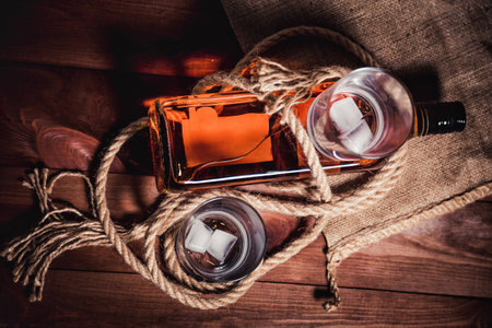 whiskey aged elite alcohol on wooden backgroundの写真素材