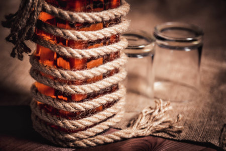 whiskey aged elite alcohol on wooden backgroundの写真素材