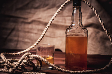 bourbon whiskey rum in a glass with iceの写真素材