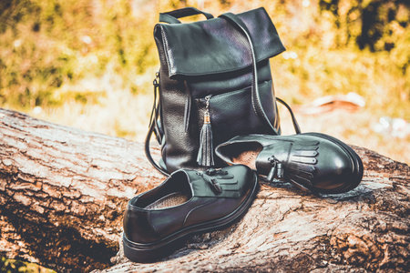 black leather shoes and a backpack, women's shoesの写真素材