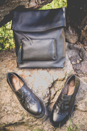 black leather shoes and a backpack, women's shoesの写真素材