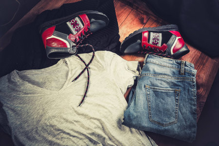 men's clothing, red sneakers on a wooden background,の写真素材