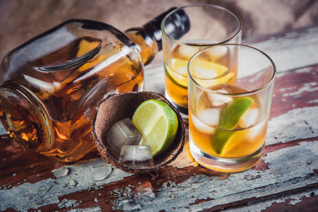 Rum with lime and ice in the hold of a pirate shipの写真素材
