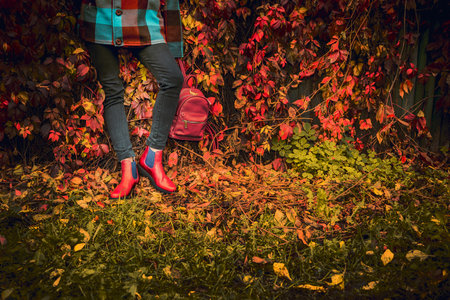 red leather boots, female autumn lookの写真素材