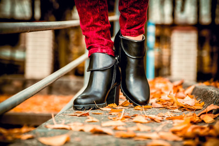 leather shoes red pants black backpack autumn female bowの写真素材