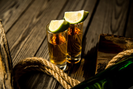 a stack of rum and tequila on a vintage background, piratesの写真素材