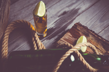 a stack of rum and tequila on a vintage background, piratesの写真素材
