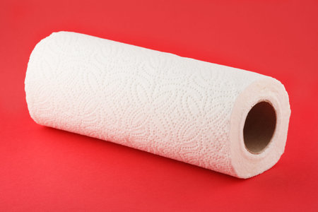 paper towels isolated on red background  roll white napkin