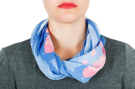 Silk scarf. Blue silk scarf around her neck isolated on white background. Female accessory.