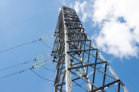 Electric pylon against the backdrop of the blue sky on a summer dayの写真素材