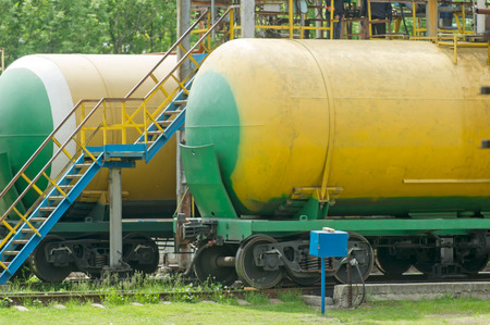 Old fuel tanks at the oil terminal on railway station on a summer dayの写真素材
