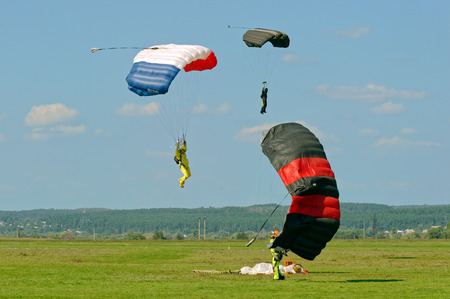 Paraglider landed after the jump at a bright sunny summer day. Active lifestyle, extreme hobbiesの写真素材