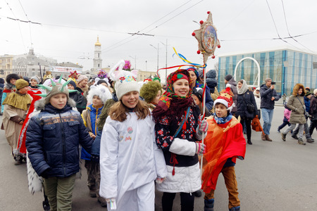 Kharkiv, Ukraine - January 13, 2018 - Participants traditional Christmas of Verteps Parade (nativity Scene), Christmas stars, carols singing. People wearing carnival clothes posing and smiling. Winter outdoor image.のeditorial素材