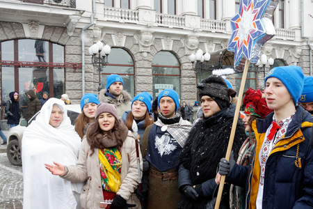 Kharkiv, Ukraine - January 13, 2018 - Participants traditional Christmas of Verteps Parade (nativity Scene), Christmas stars, carols singing. People wearing carnival clothes posing and smiling. Winter outdoor image.のeditorial素材
