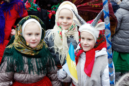 Kharkiv, Ukraine - January 13, 2018 - Participants traditional Christmas of Verteps Parade (nativity Scene), Christmas stars, carols singing. People wearing carnival clothes posing and smiling. Winter outdoor image.のeditorial素材