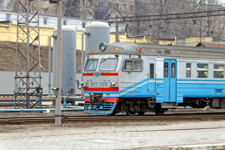Kharkiv, Ukraine - March 25, 2012: Locomotive of the Kharkiv Passenger Railway Station. Passenger train lines. Ukrzaliznytsia passenger coaches cars.のeditorial素材