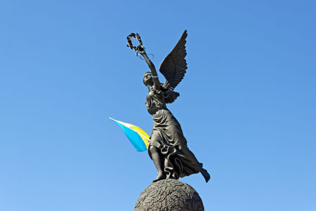 Monument in honor of the Independence of Ukraine with flag in spring summer day at Constitution square in Kharkiv, Ukraineのeditorial素材