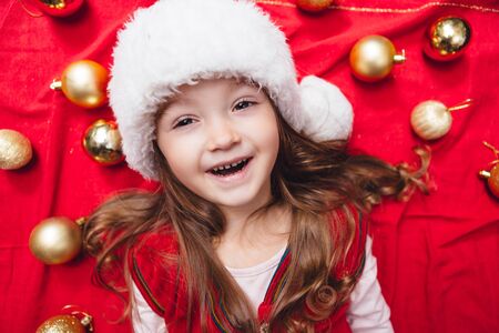Close-up portrait of cute christmas girl with decorationの写真素材