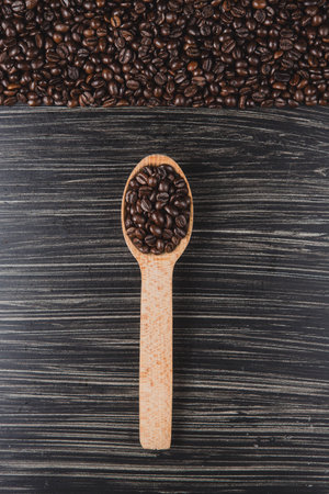 Copy space image of coffee Beans in wooden spoonの写真素材