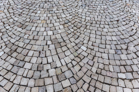 Street floor with old stone pavement textureの写真素材