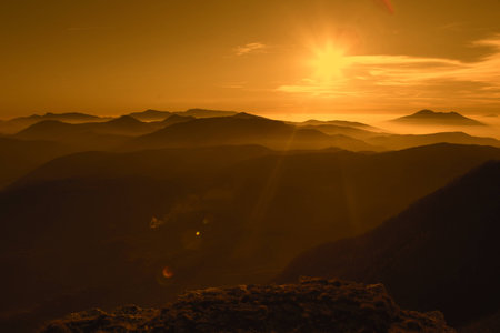 Great sunset on mountains with fog. Beautiful backgroundの写真素材