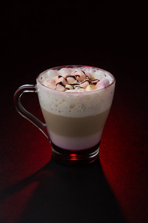 Amazing coffee cup on dark red backgroundの写真素材