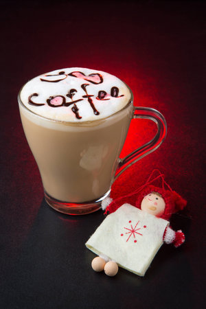 white cup and saucer with hot coffee, on red backgroundの写真素材
