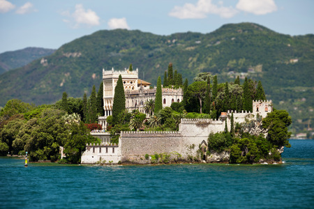 GARDA LAKE, ITALY - JUNE 15, 2013: Villa Cavazzi in venetian neogothic style on island in Garda lake, 15 june 2013, Garda lake, Italyのeditorial素材