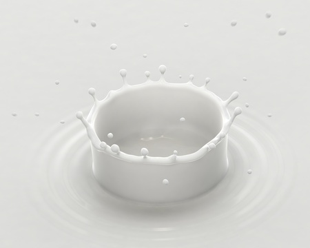 Milk splash and drops with ripples, close-up view.の写真素材