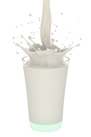 Pouring milk in a glass created splash on white.の写真素材