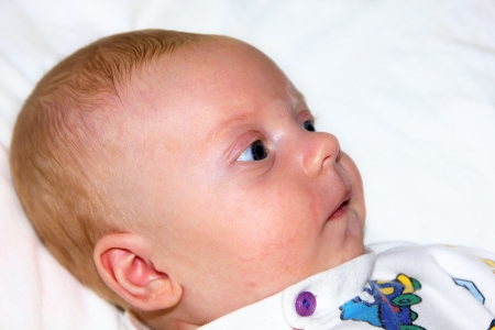 Portrait of lying 2-month old baby boy の写真素材