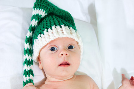 Portrait of lying 2-month old baby boy.