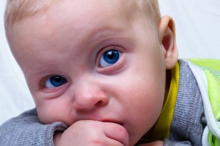 Portrait of serious six month old baby boy の写真素材
