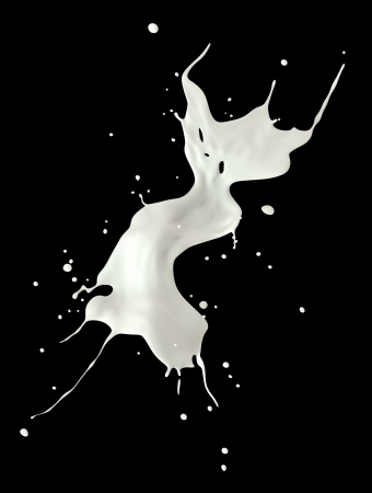 Milk splash isolated on black background の写真素材