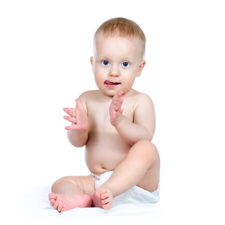 Nine month boy applauding, on white background の写真素材