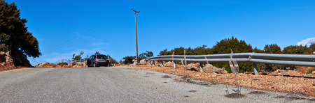 Mountain road and car on Crete, Greece.の写真素材