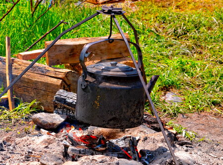 Teapot on the campfireの写真素材